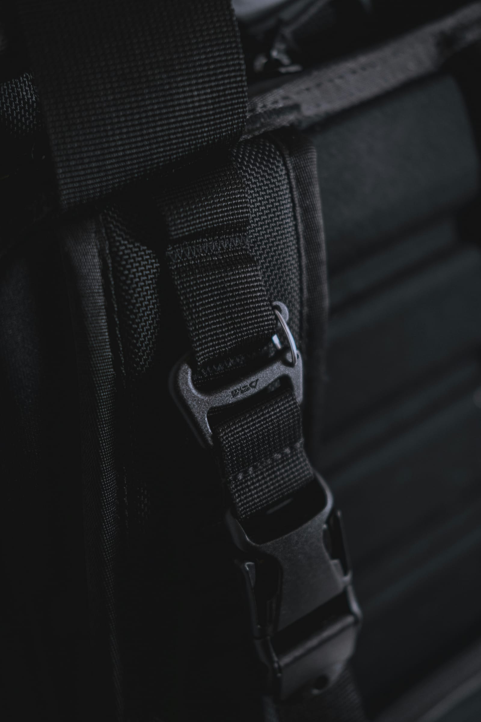 Premium Carry Strap clipped to a bottle, slung over a shoulder