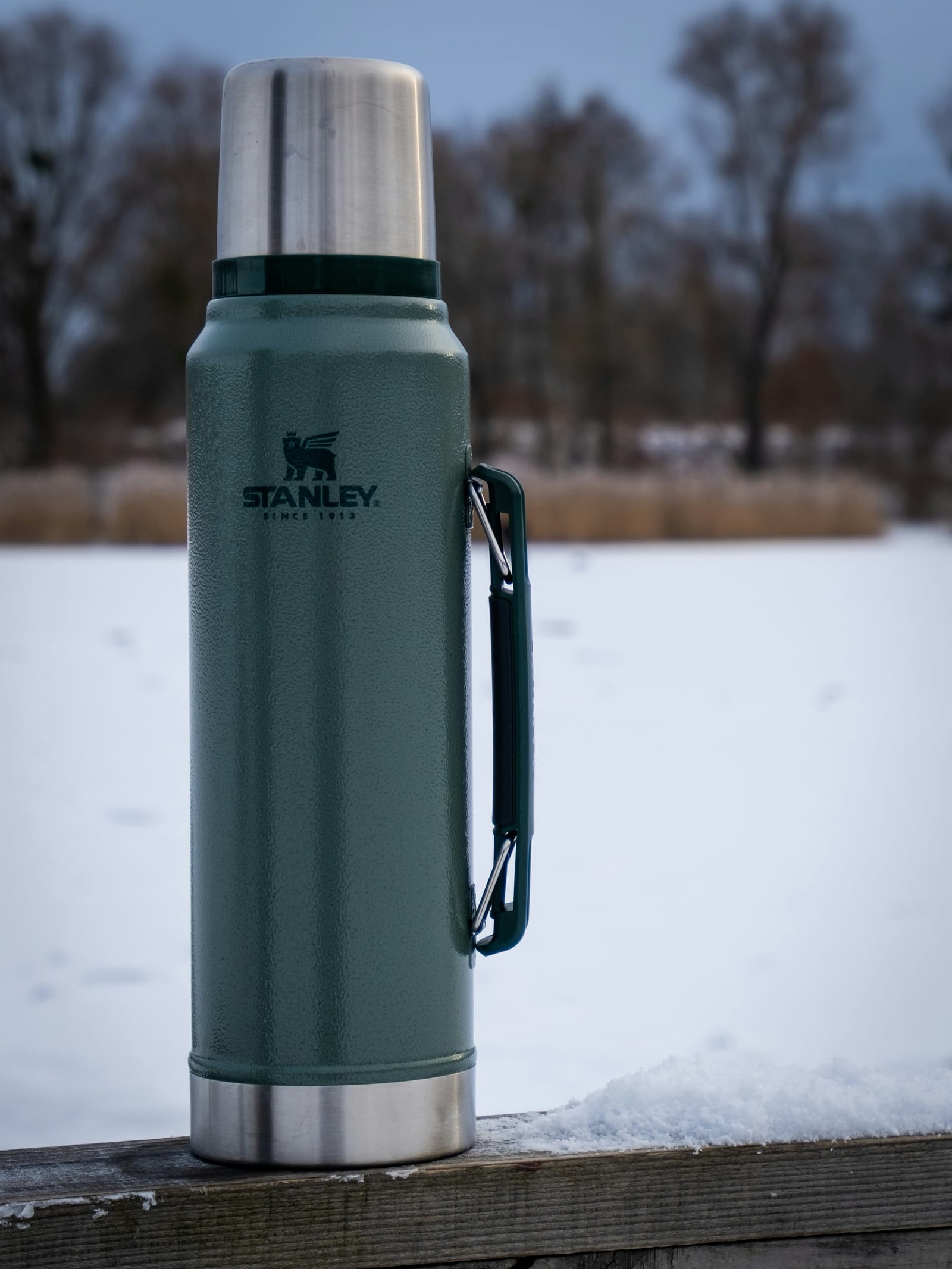 Glacier Bottle half-buried in fresh snow on a col